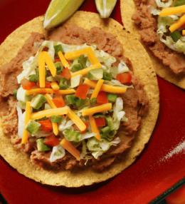 Honduran Catrachitas (Tortilla Chips with Beans and Cheese)