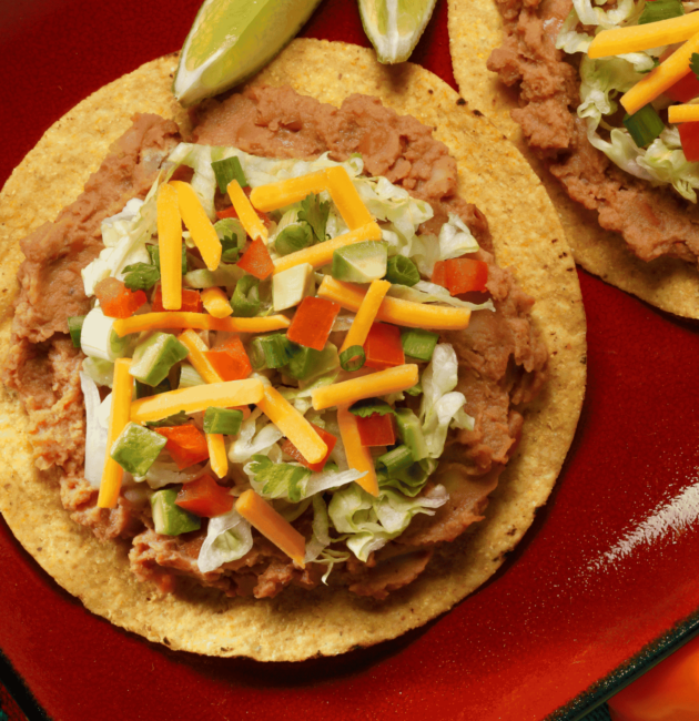 Catrachitas (Tortilla Chips with Beans and Cheese)